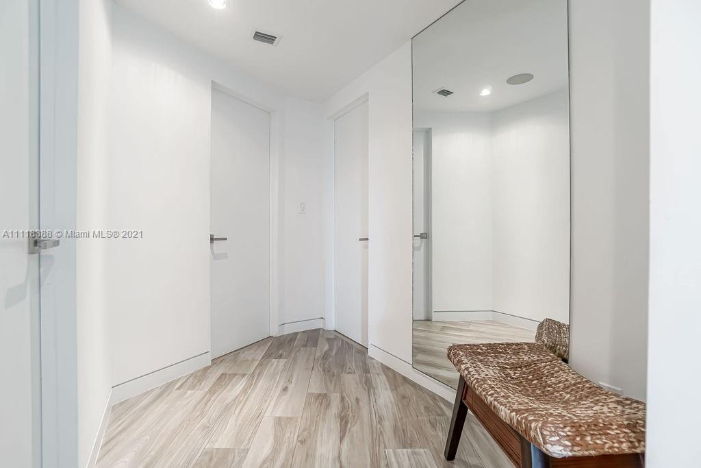 2127 Brickell Avenue, Unit 503 Miami, FL 33129 - Photo 25 of 54 a view of room with window and hardwood floor
