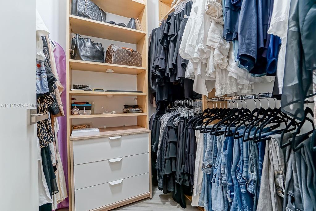 2127 Brickell Avenue, Unit 503 Miami, FL 33129 - Photo 26 of 54 a view of walk in closet with clothes and shoes