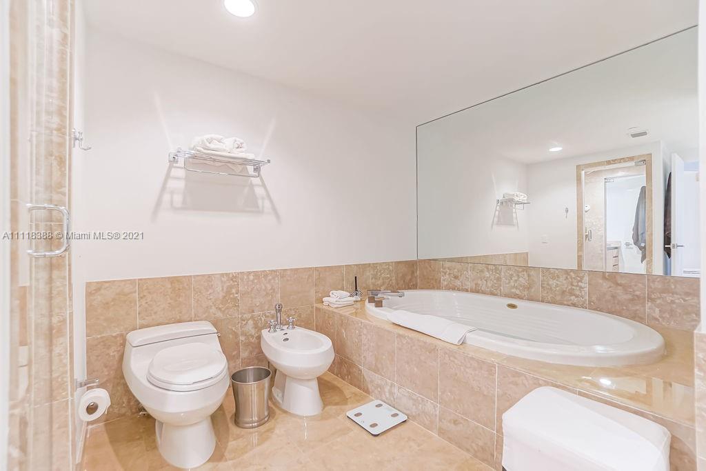 2127 Brickell Avenue, Unit 503 Miami, FL 33129 - Photo 28 of 54 a bathroom with a sink a toilet and a bathtub
