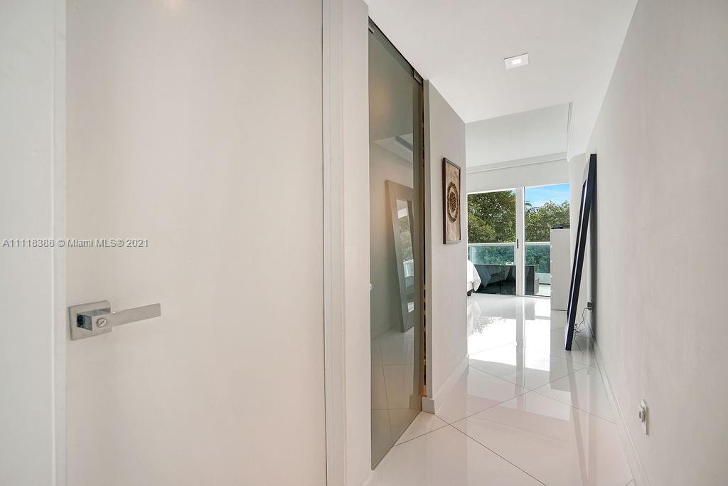 2127 Brickell Avenue, Unit 503 Miami, FL 33129 - Photo 33 of 54 a bathroom with a glass shower door