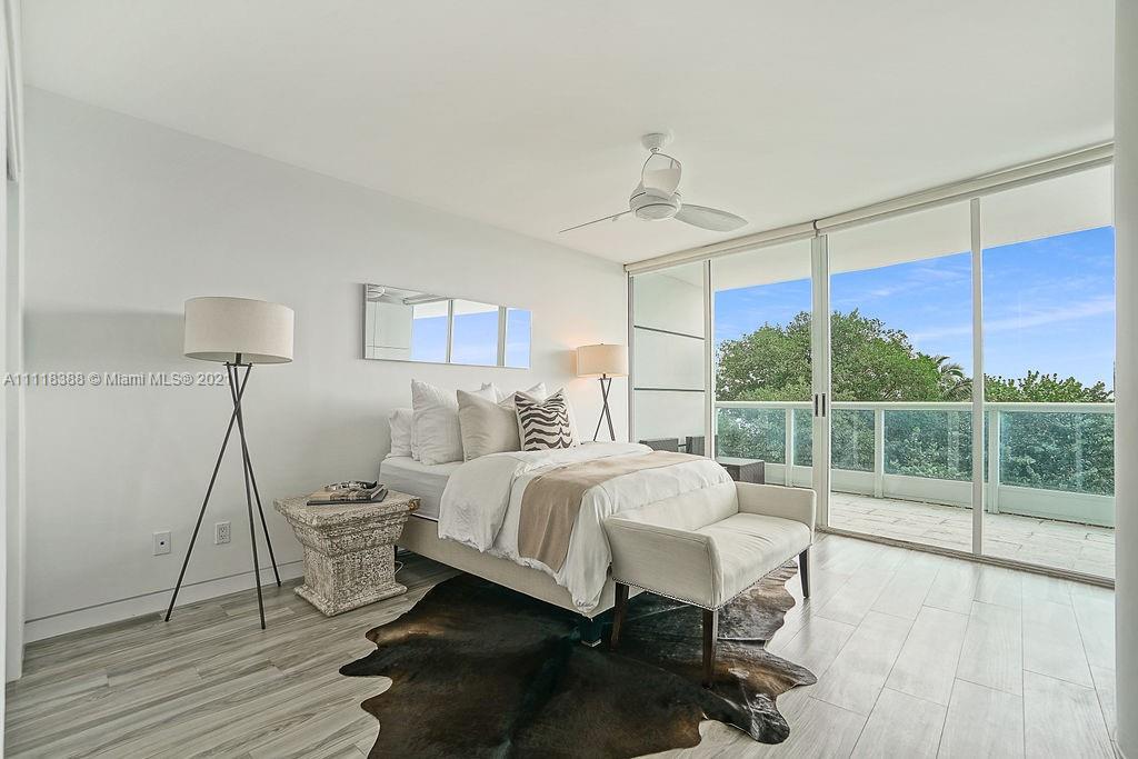 2127 Brickell Avenue, Unit 503 Miami, FL 33129 - Photo 37 of 54 a bedroom with a bed and a window