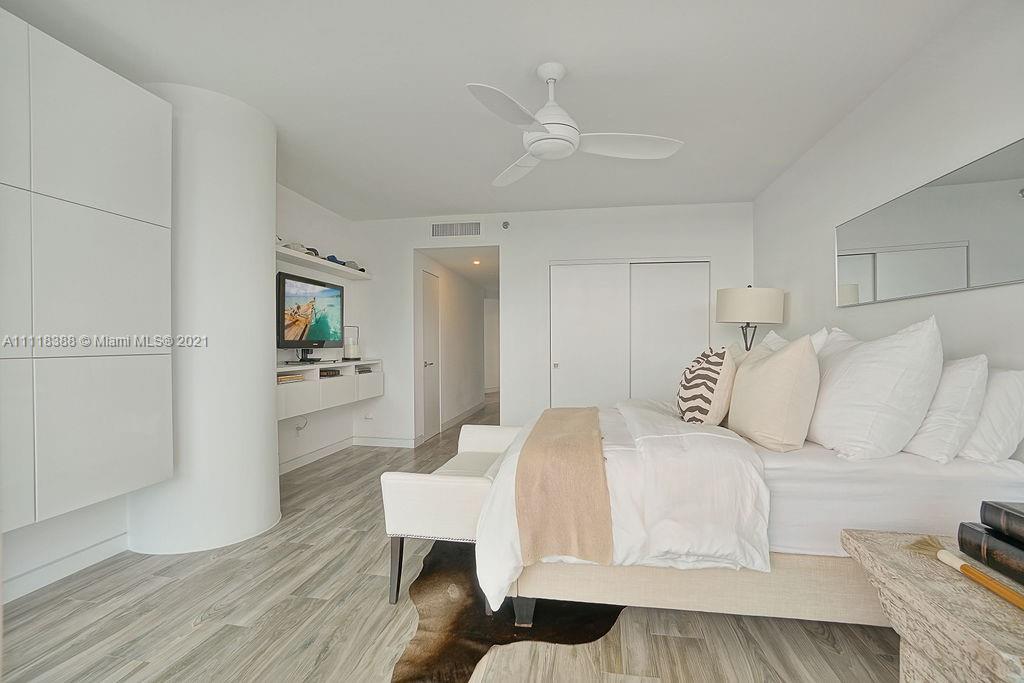 2127 Brickell Avenue, Unit 503 Miami, FL 33129 - Photo 38 of 54 a living room with furniture and a wooden floor