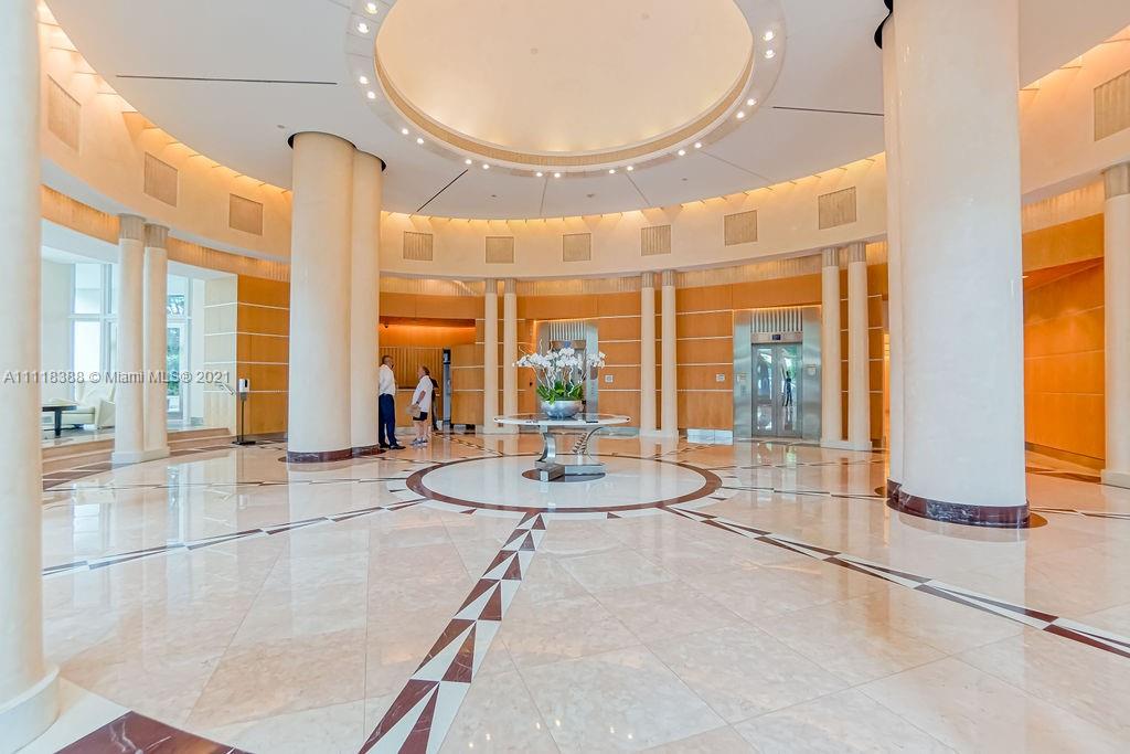 2127 Brickell Avenue, Unit 503 Miami, FL 33129 - Photo 43 of 54 a room with gym equipment and a large window