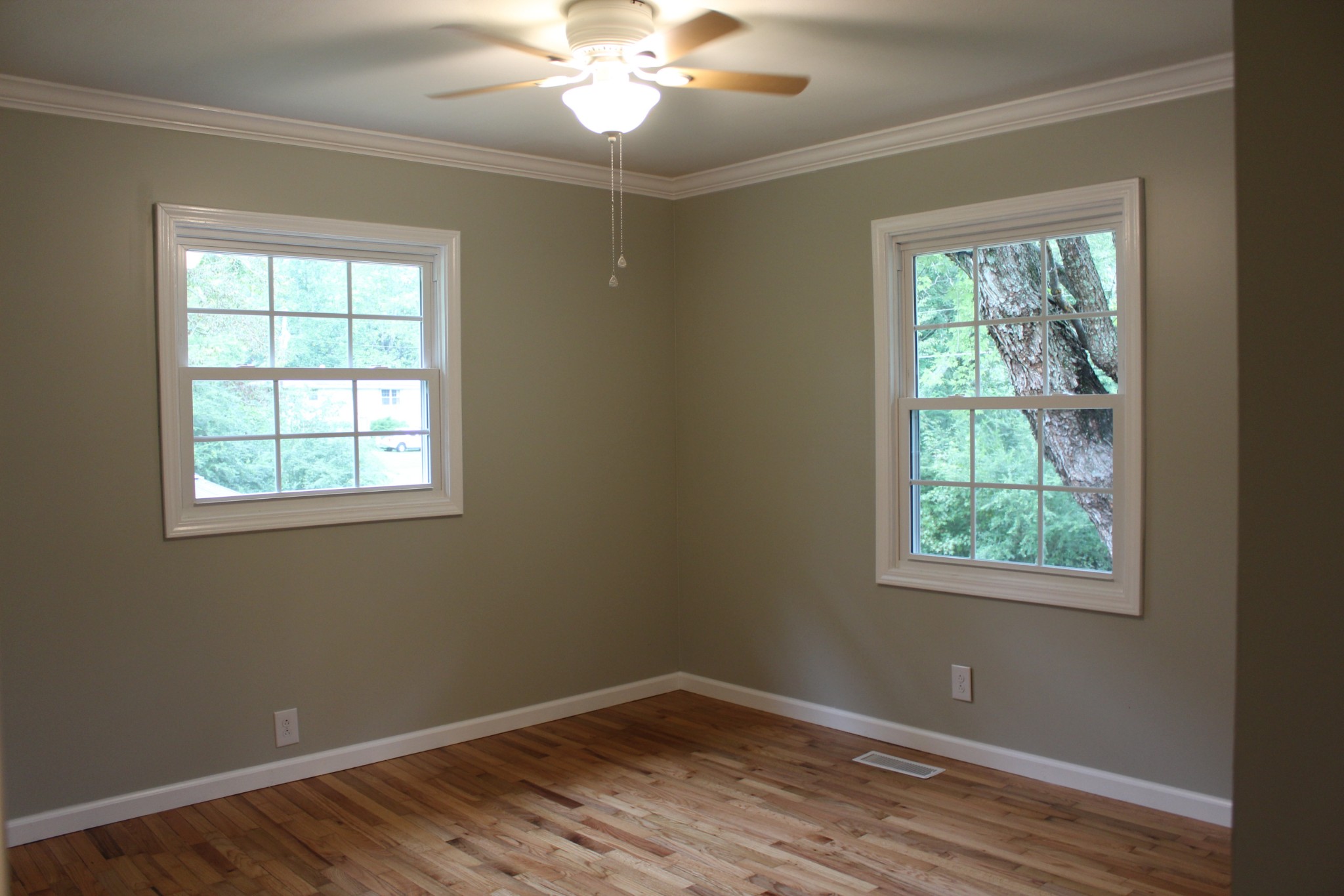 70 Pond Drive Tennessee Ridge, TN 37178 - Photo 12 of 28 a view of an empty room with wooden floor and a window