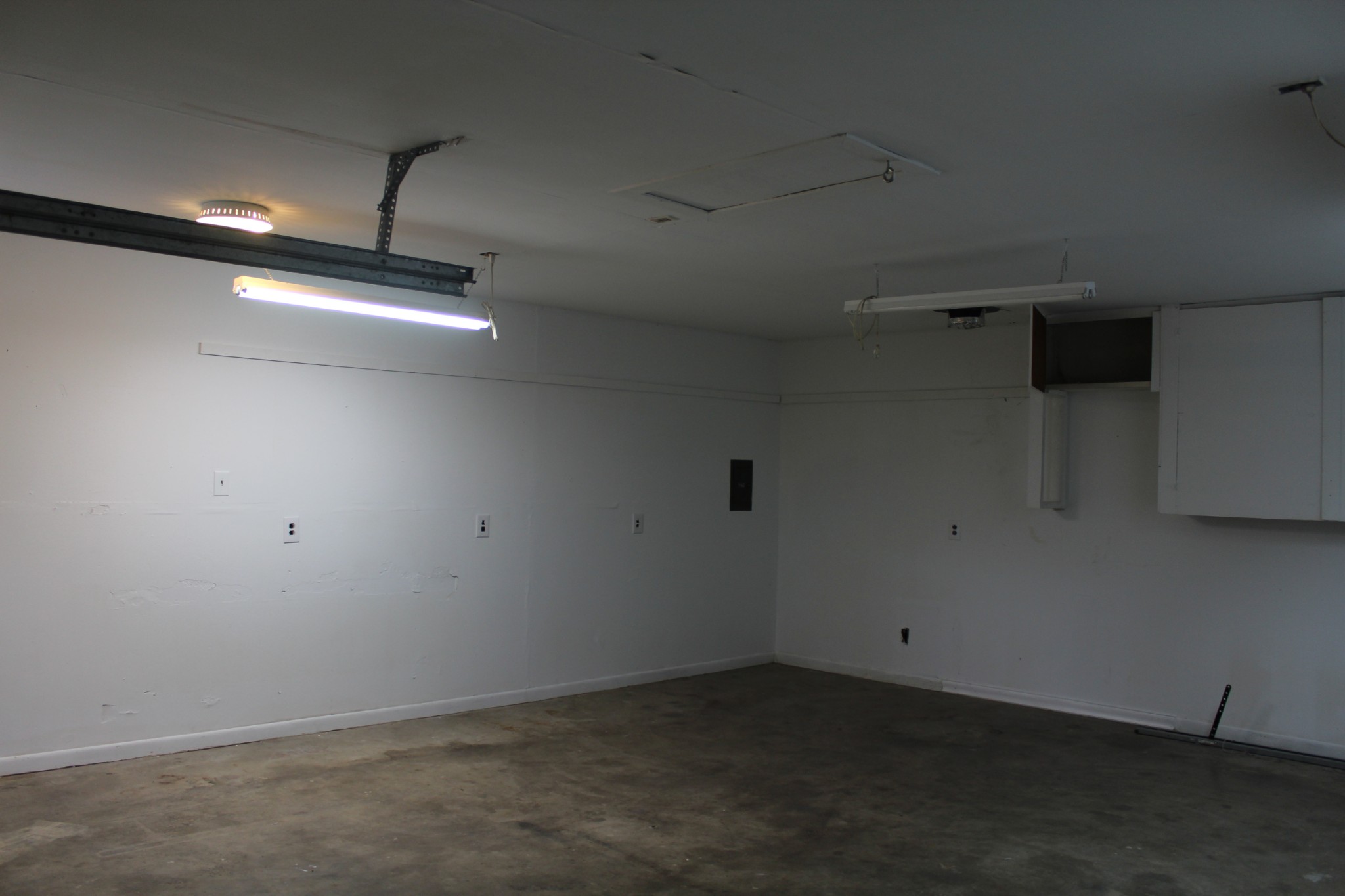 70 Pond Drive Tennessee Ridge, TN 37178 - Photo 22 of 28 an empty room with a ceiling fan and kitchen view