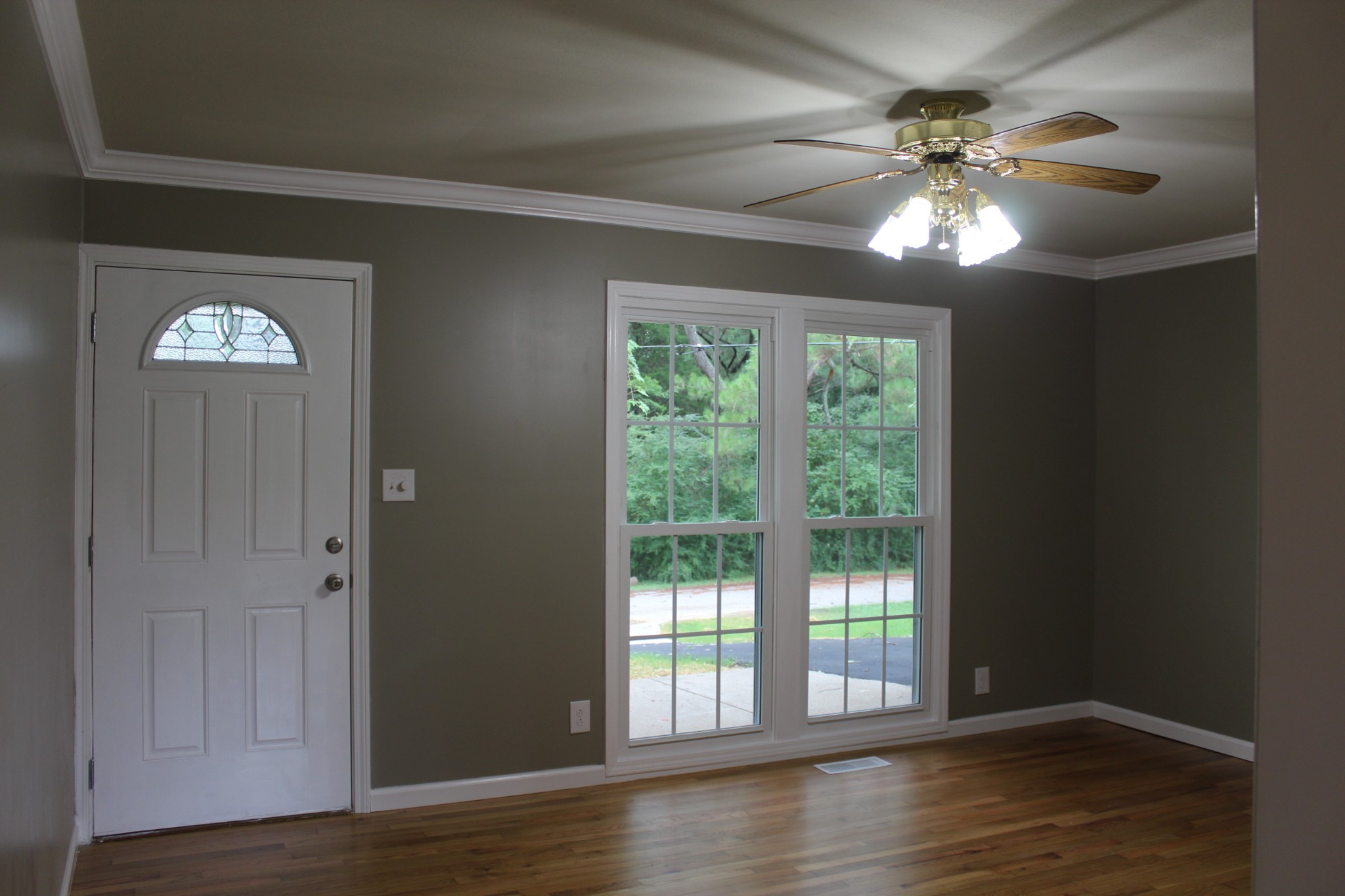 70 Pond Drive Tennessee Ridge, TN 37178 - Photo 10 of 28 a view of an empty room with wooden floor and a window