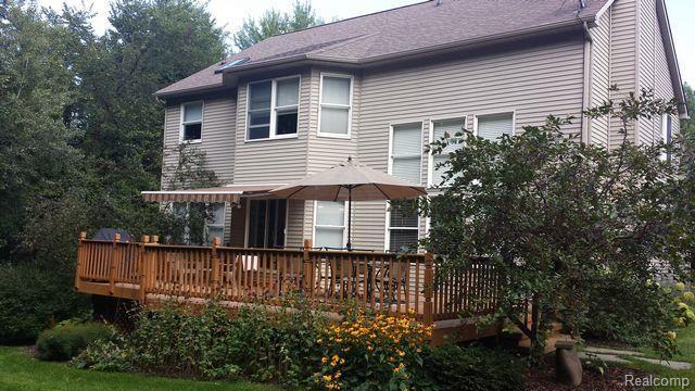 8028 McClements Road Brighton, MI 48114 - Photo 22 of 28 Private deck with awning, it is a great space for summertime fun