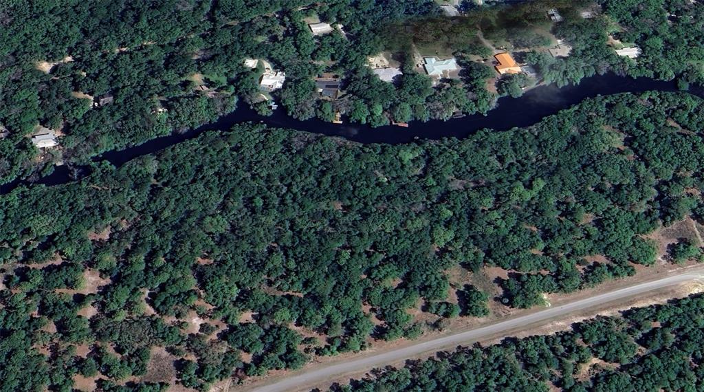 13577 West Foss Grove Path Inglis, FL 34449 - Photo 4 of 4 a view of a garden from a balcony