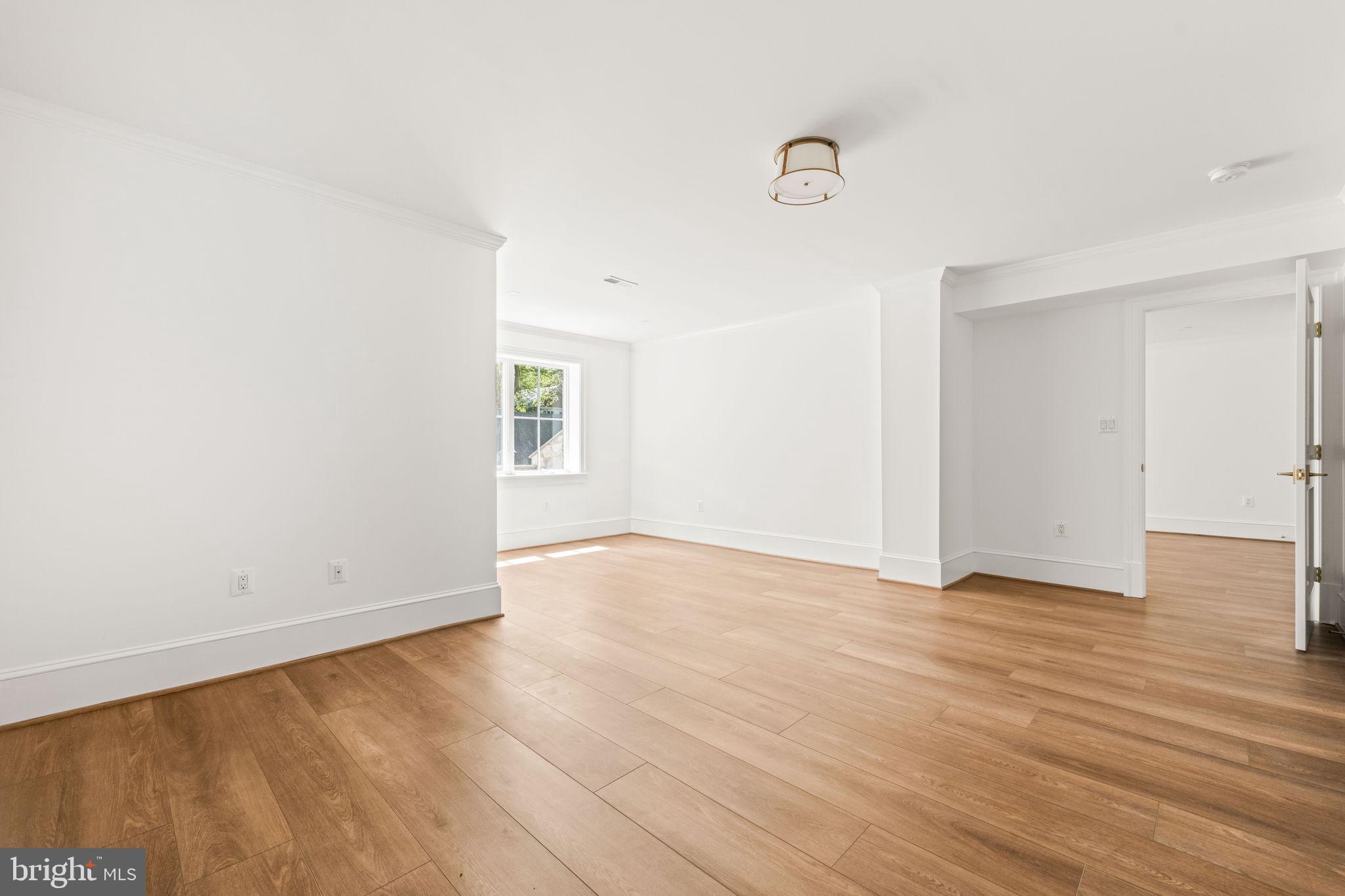 414 Rucker Place Alexandria, VA 22301 - Photo 102 of 135 an empty room with wooden floor and windows