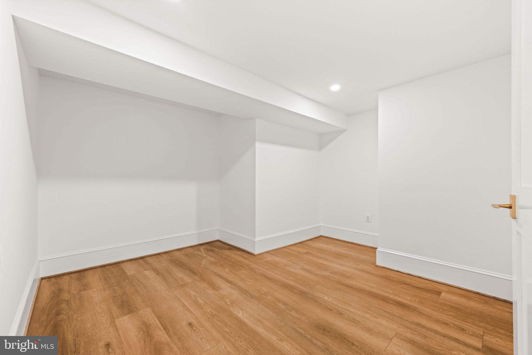 414 Rucker Place Alexandria, VA 22301 - Photo 107 of 135 a view of empty room with wooden floor