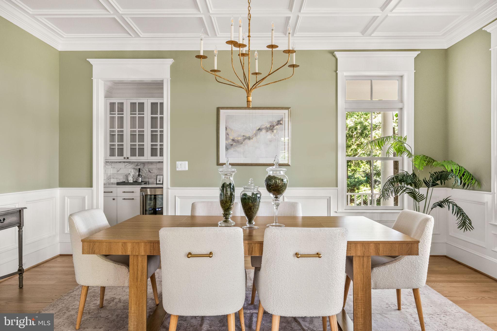 414 Rucker Place Alexandria, VA 22301 - Photo 17 of 135 a dining room with furniture a window and a chandelier