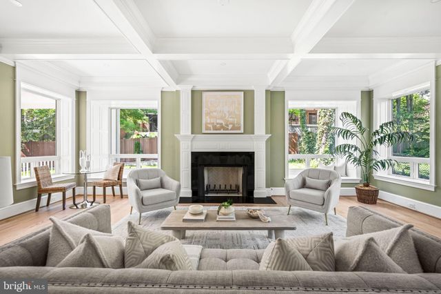 a bedroom with a large bed and a fireplace