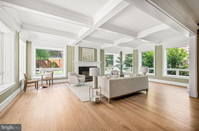 a bathroom with a granite countertop sink mirror and shower