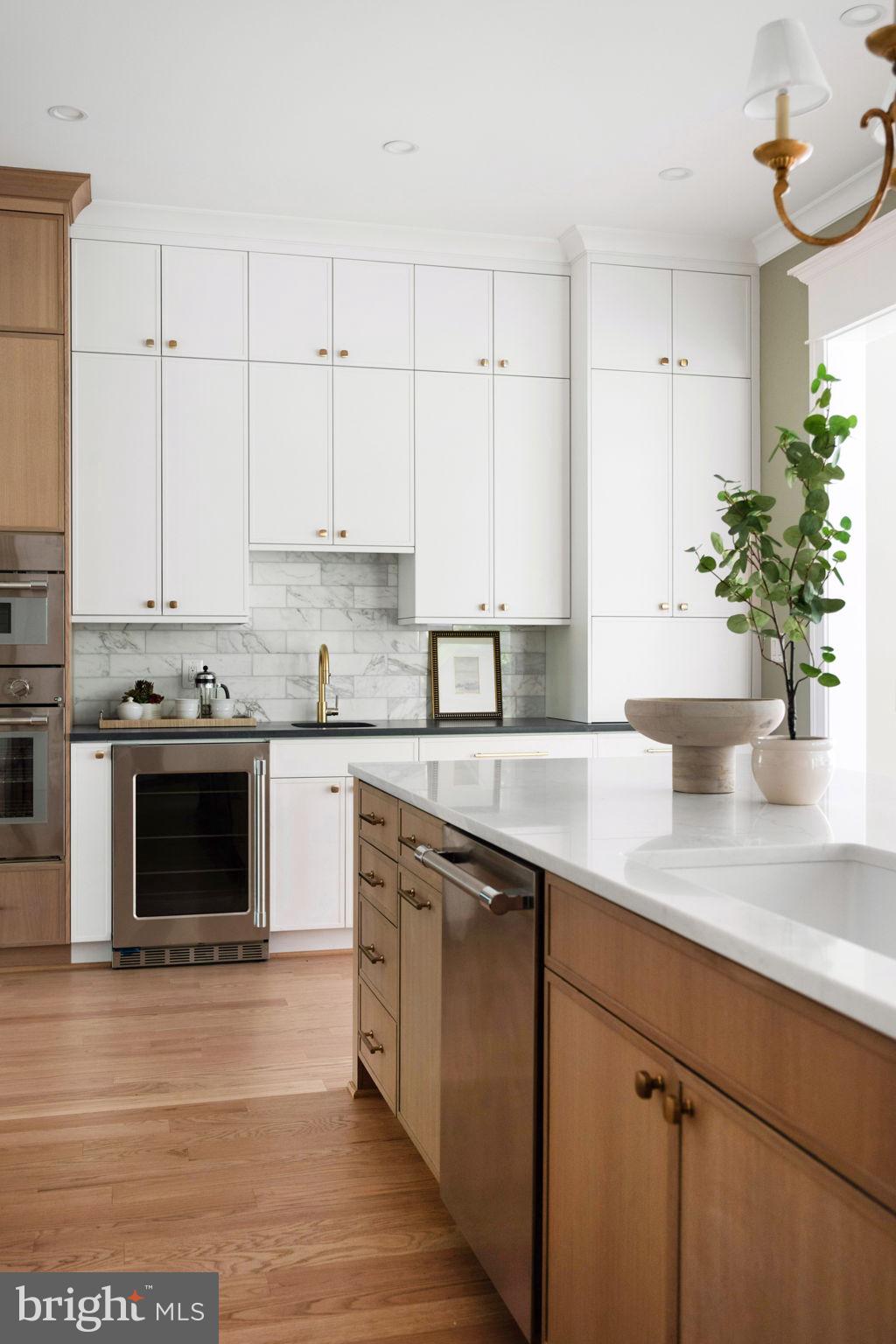 414 Rucker Place Alexandria, VA 22301 - Photo 38 of 135 a kitchen with stainless steel appliances granite countertop a stove a sink and white cabinets