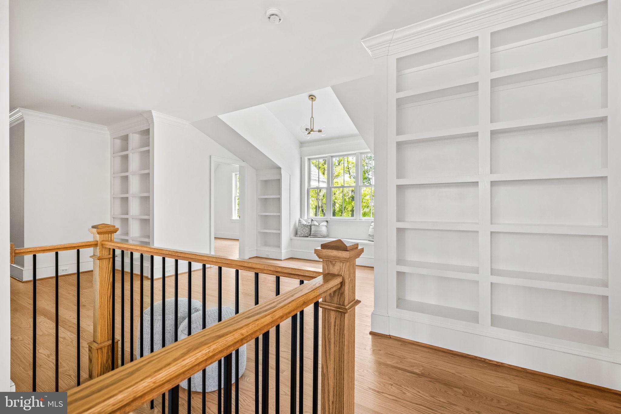 414 Rucker Place Alexandria, VA 22301 - Photo 60 of 135 a view of a hallway with wooden floor and stairs