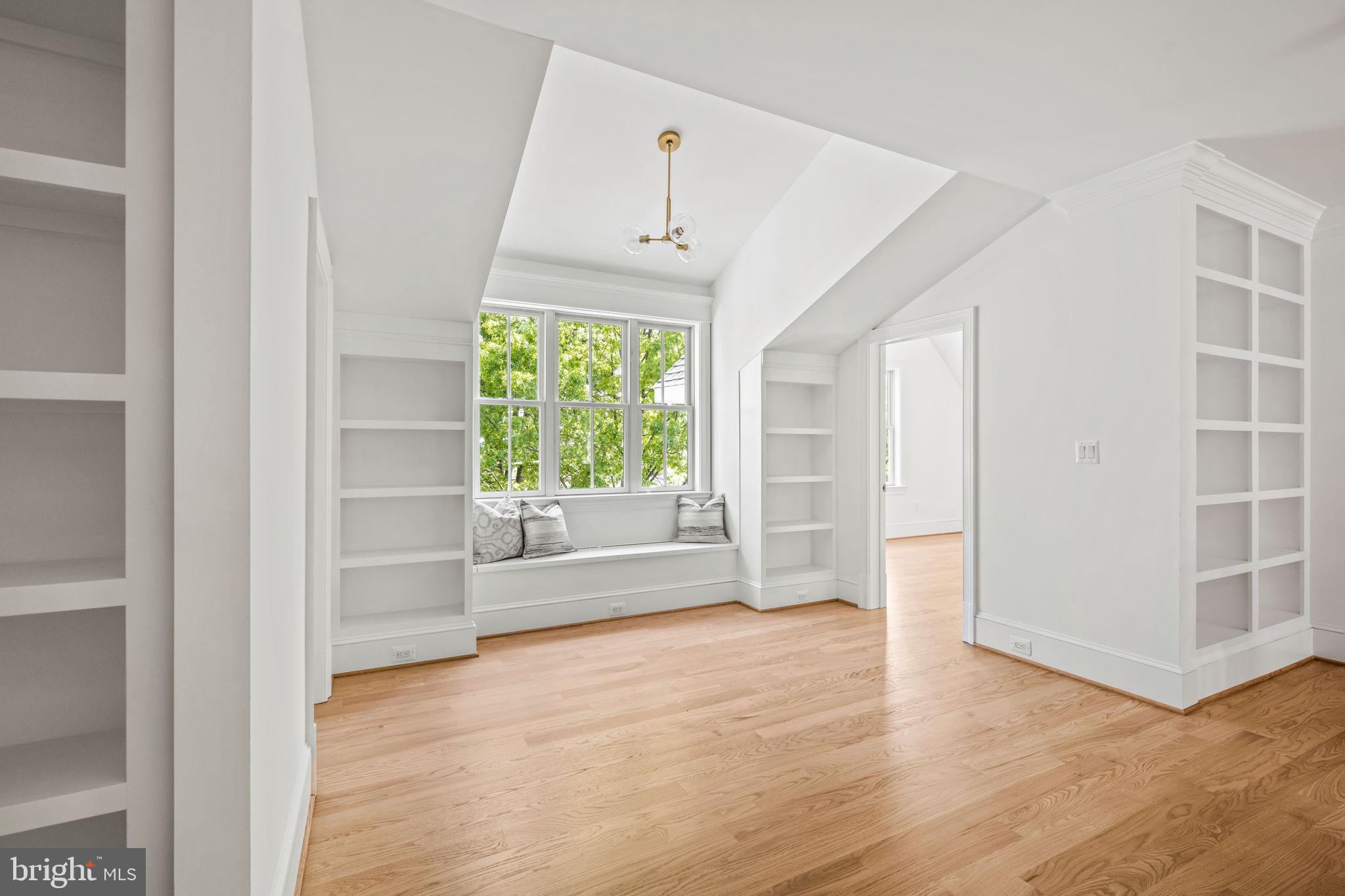 414 Rucker Place Alexandria, VA 22301 - Photo 62 of 135 an empty room with wooden floor cabinet and windows