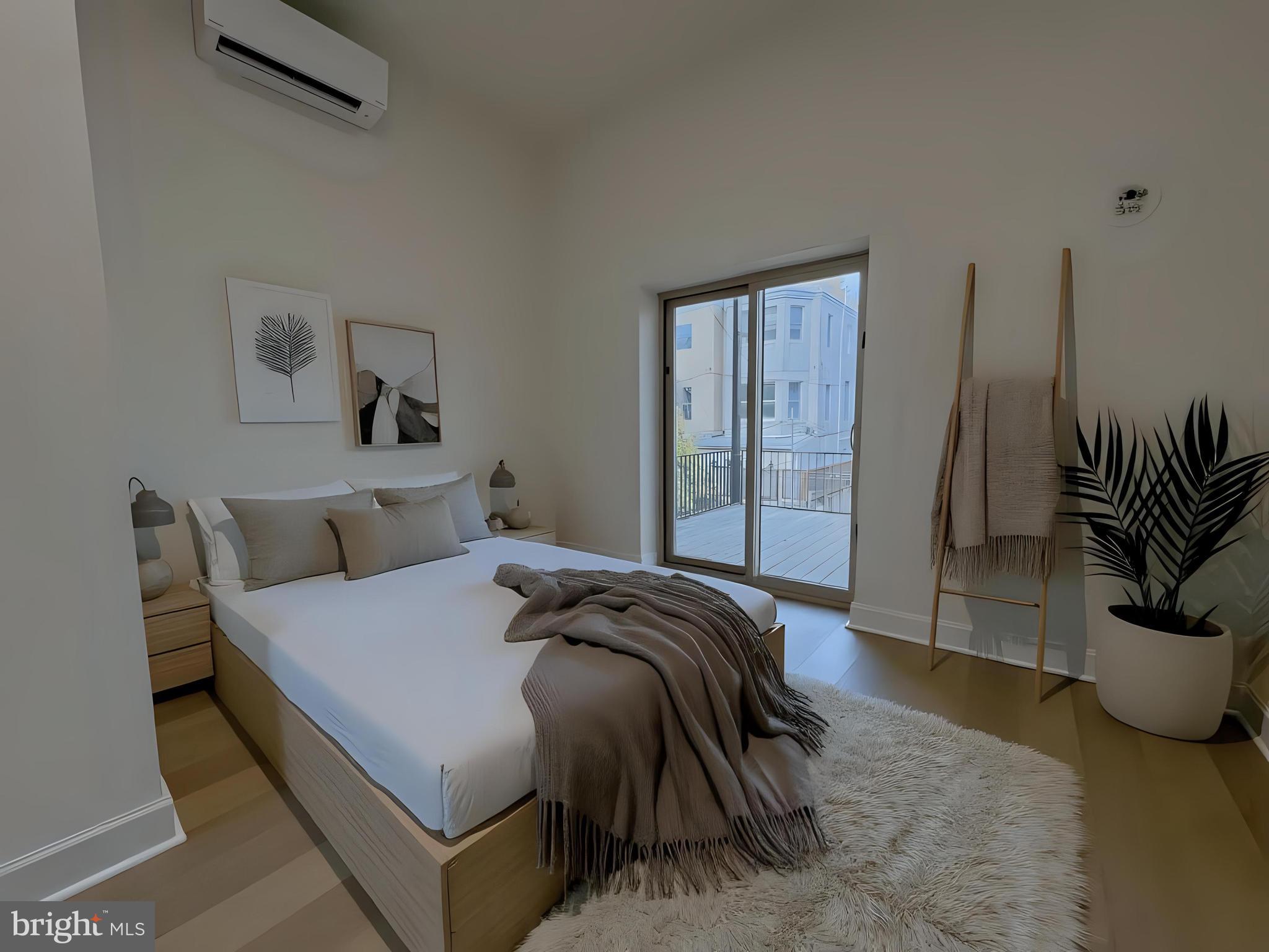 a bed sitting in a bedroom next to a window