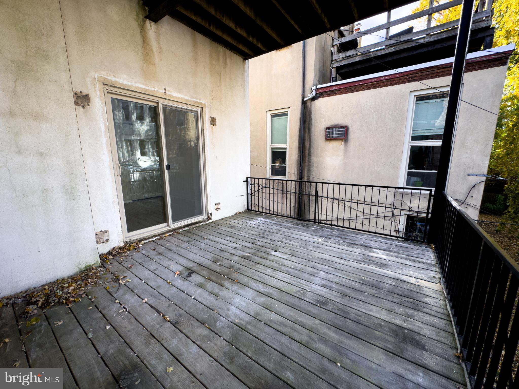 2007 Green Street, Unit 2R Philadelphia, PA 19130 - Photo 14 of 15 a view of a balcony with wooden floor