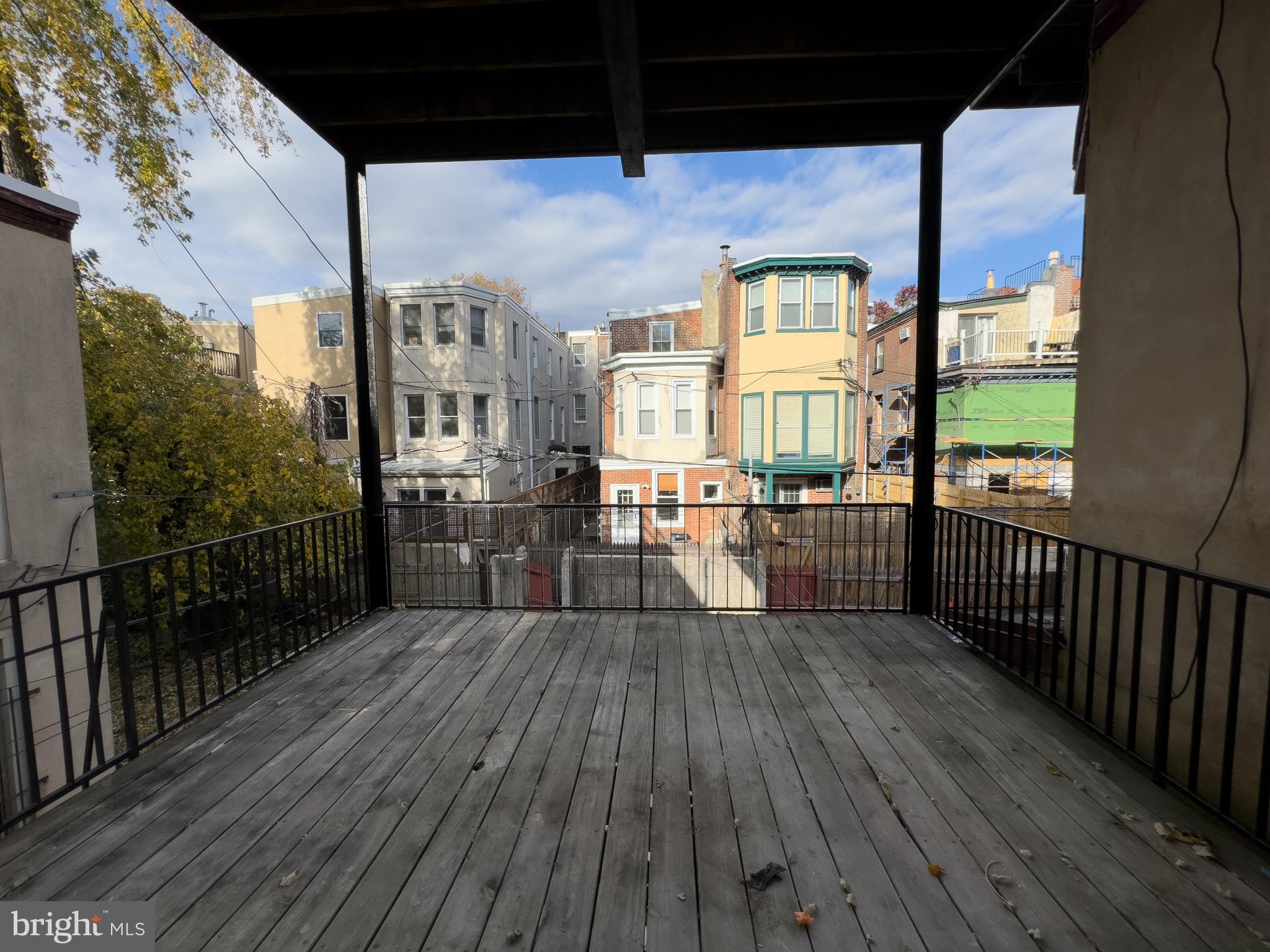 2007 Green Street, Unit 2R Philadelphia, PA 19130 - Photo 15 of 15 a view of a porch with wooden floor and iron fence