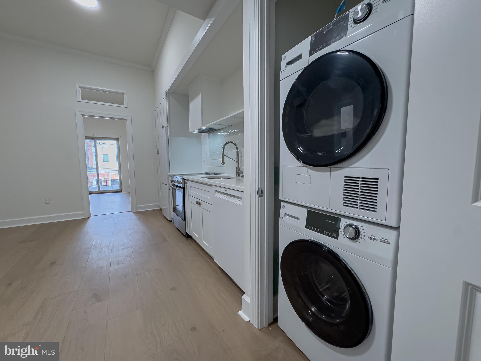 2007 Green Street, Unit 2R Philadelphia, PA 19130 - Photo 5 of 15 a view of a hallway with washer and dryer