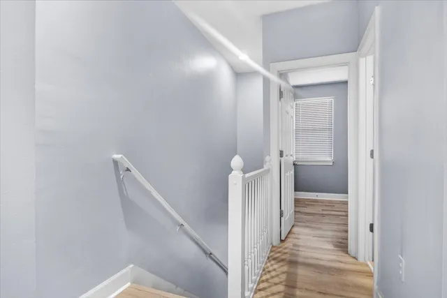 a view of a hallway with a white walls