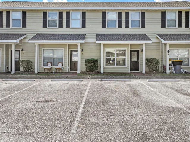 front view of a brick house with a outdoor space