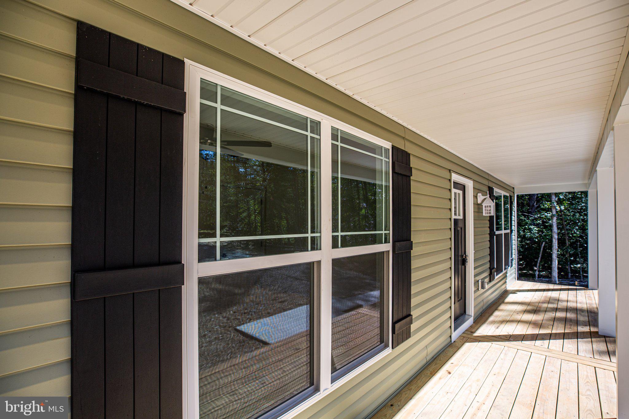 69 Pinewood Lane, Unit L18 Colonial Beach, VA 22443 - Photo 17 of 28 a view of a balcony with a large window