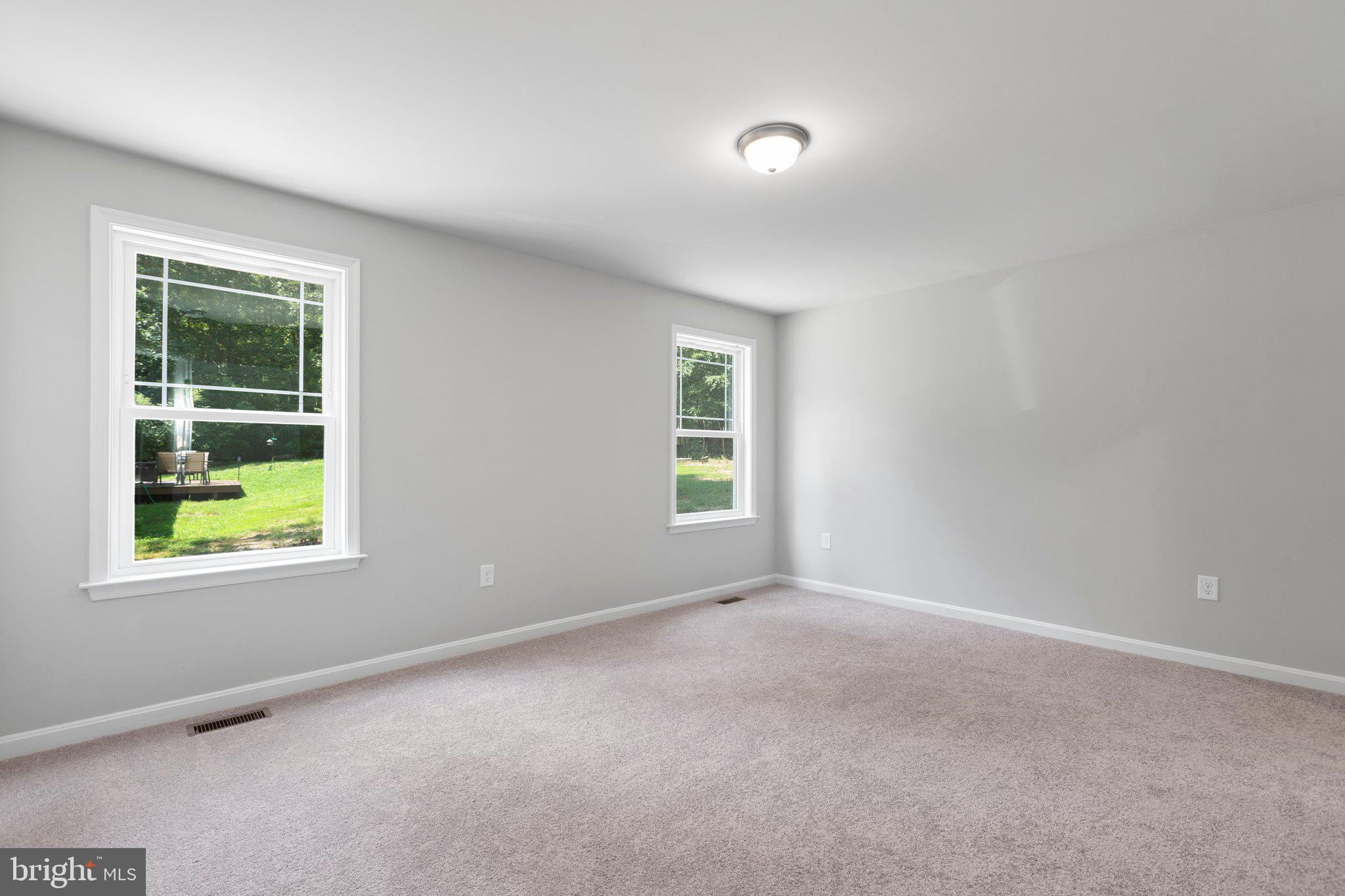 69 Pinewood Lane, Unit L18 Colonial Beach, VA 22443 - Photo 8 of 28 an empty room with windows