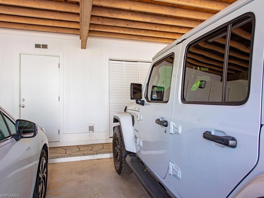 536 2nd Street South, Unit 536 Naples, FL 34102 - Photo 11 of 14 Garage with washing machine and clothes dryer