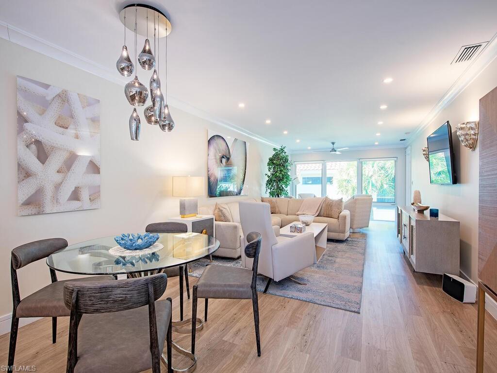 536 2nd Street South, Unit 536 Naples, FL 34102 - Photo 3 of 14 Dining area with ornamental molding, light wood-style floors, recessed lighting, and a ceiling fan