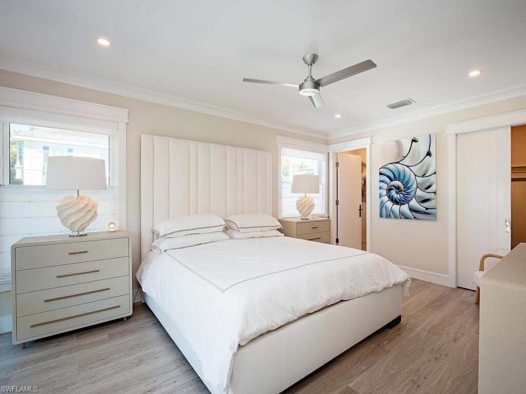 536 2nd Street South, Unit 536 Naples, FL 34102 - Photo 6 of 14 Bedroom featuring light wood-type flooring, ornamental molding, ceiling fan, recessed lighting, and a closet