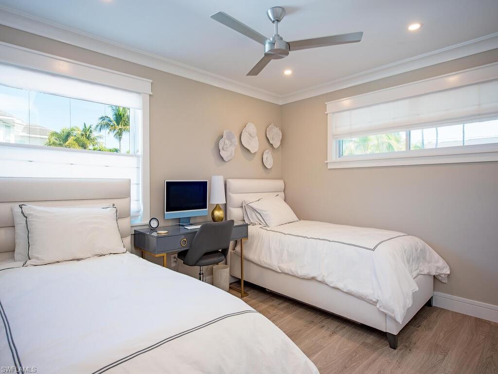 536 2nd Street South, Unit 536 Naples, FL 34102 - Photo 8 of 14 Bedroom featuring light wood finished floors, ornamental molding, recessed lighting, ceiling fan, and an office area