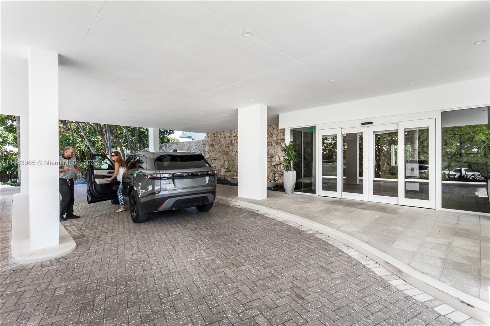 200 Ocean Ln Drive, Unit 703 Key Biscayne, FL 33149 - Photo 15 of 26 a car parked in front of a house