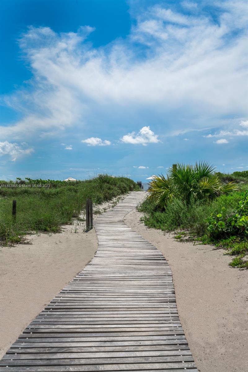 200 Ocean Ln Drive, Unit 703 Key Biscayne, FL 33149 - Photo 18 of 26 a view of a lake with beach
