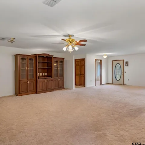 a kitchen with stainless steel appliances granite countertop a stove and a refrigerator