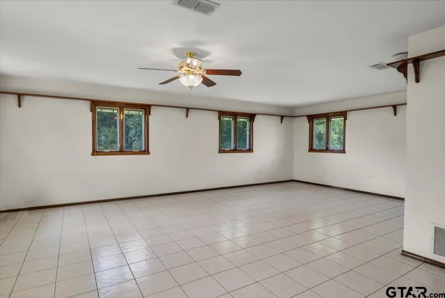 a view of a house with yard and a garden