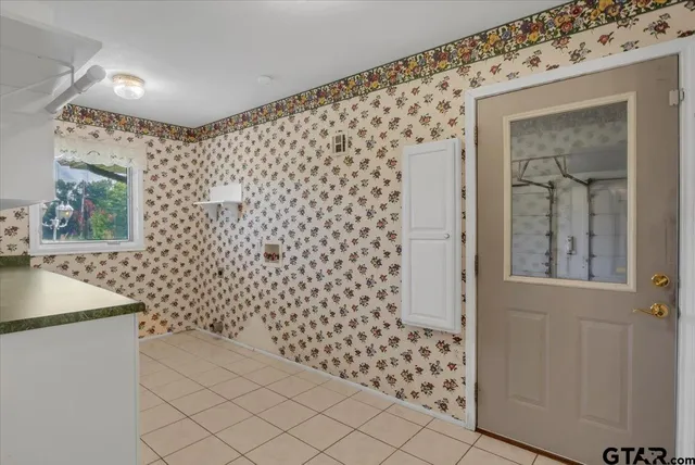 a front view of a house with yard and green space