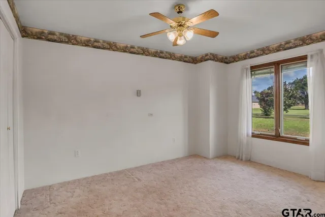 an aerial view of residential houses with outdoor space and lake view