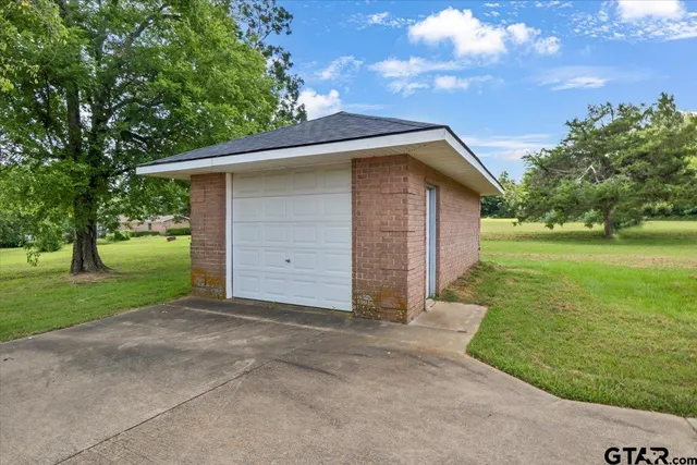 a view of house with a garden