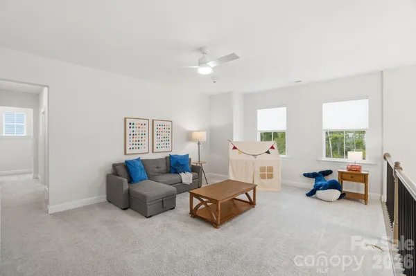 a bedroom with a bed and flat screen tv