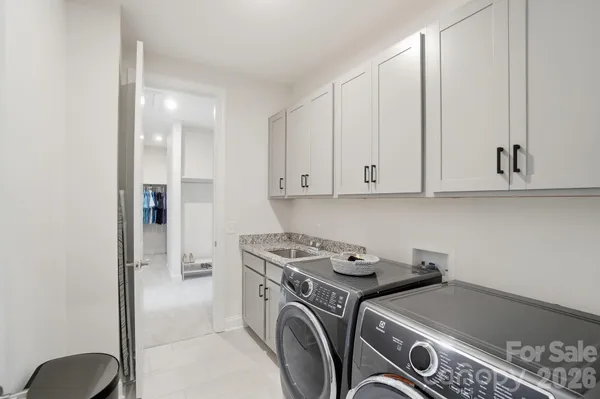 a picture of a room with toys and a painting on the wall