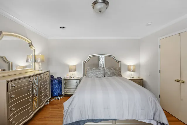 a bedroom with a bed and a mirror