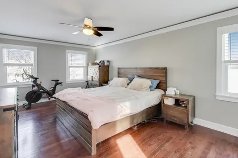 a bedroom with a bed and window