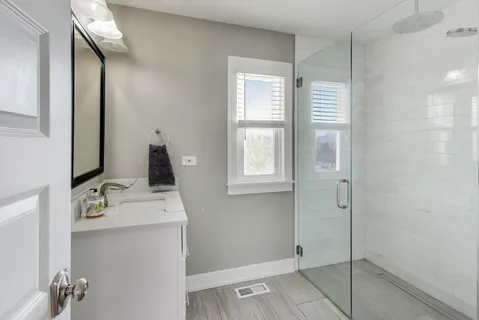 a view of bathroom with dual sinks