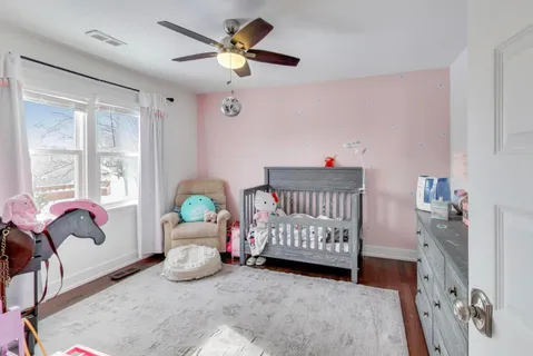 a bedroom with furniture and a window
