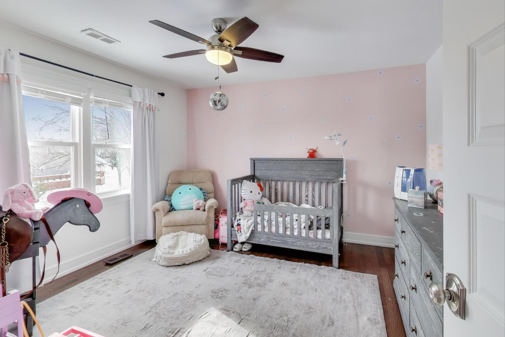 1565 Brittany Lane Hoffman Estates, IL 60192 - Photo 16 of 26 a bedroom with furniture and a window