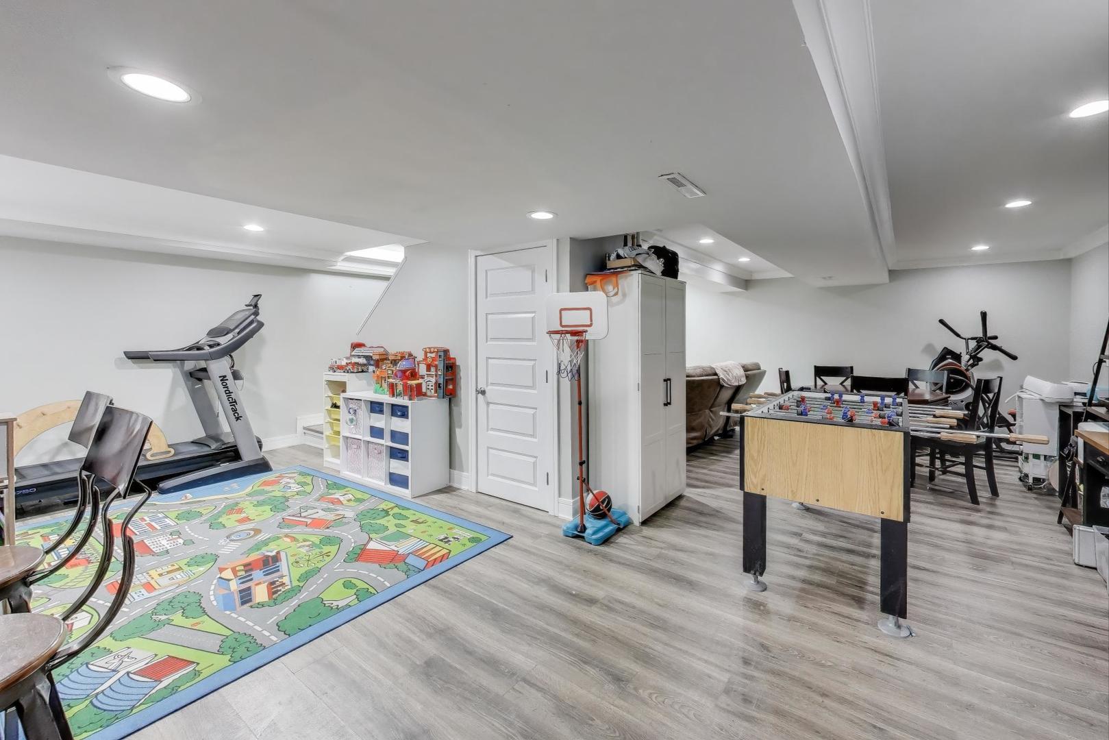 1565 Brittany Lane Hoffman Estates, IL 60192 - Photo 20 of 26 a living room with furniture and a wooden floor