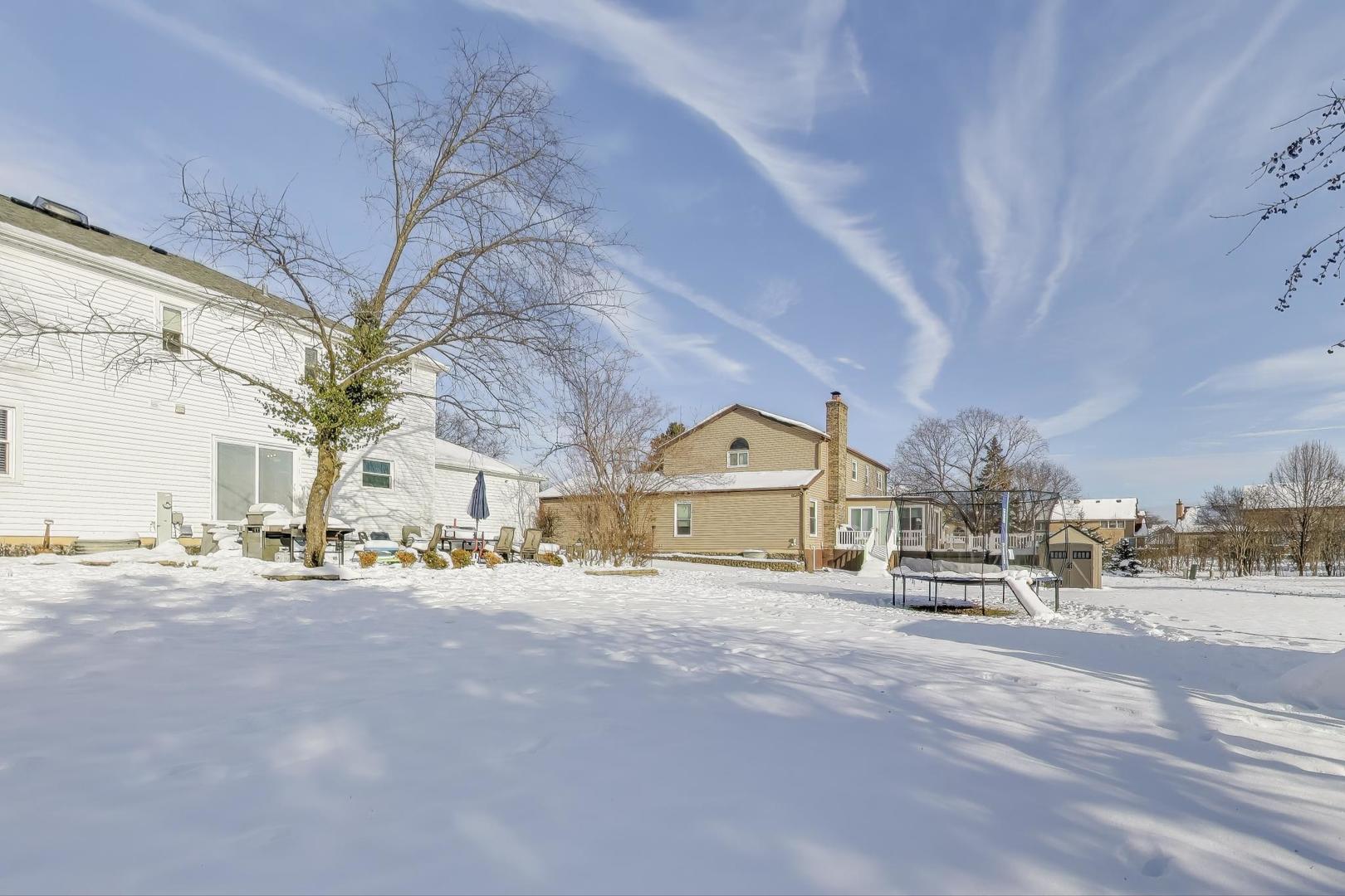 1565 Brittany Lane Hoffman Estates, IL 60192 - Photo 22 of 26 a view of a city street with a building