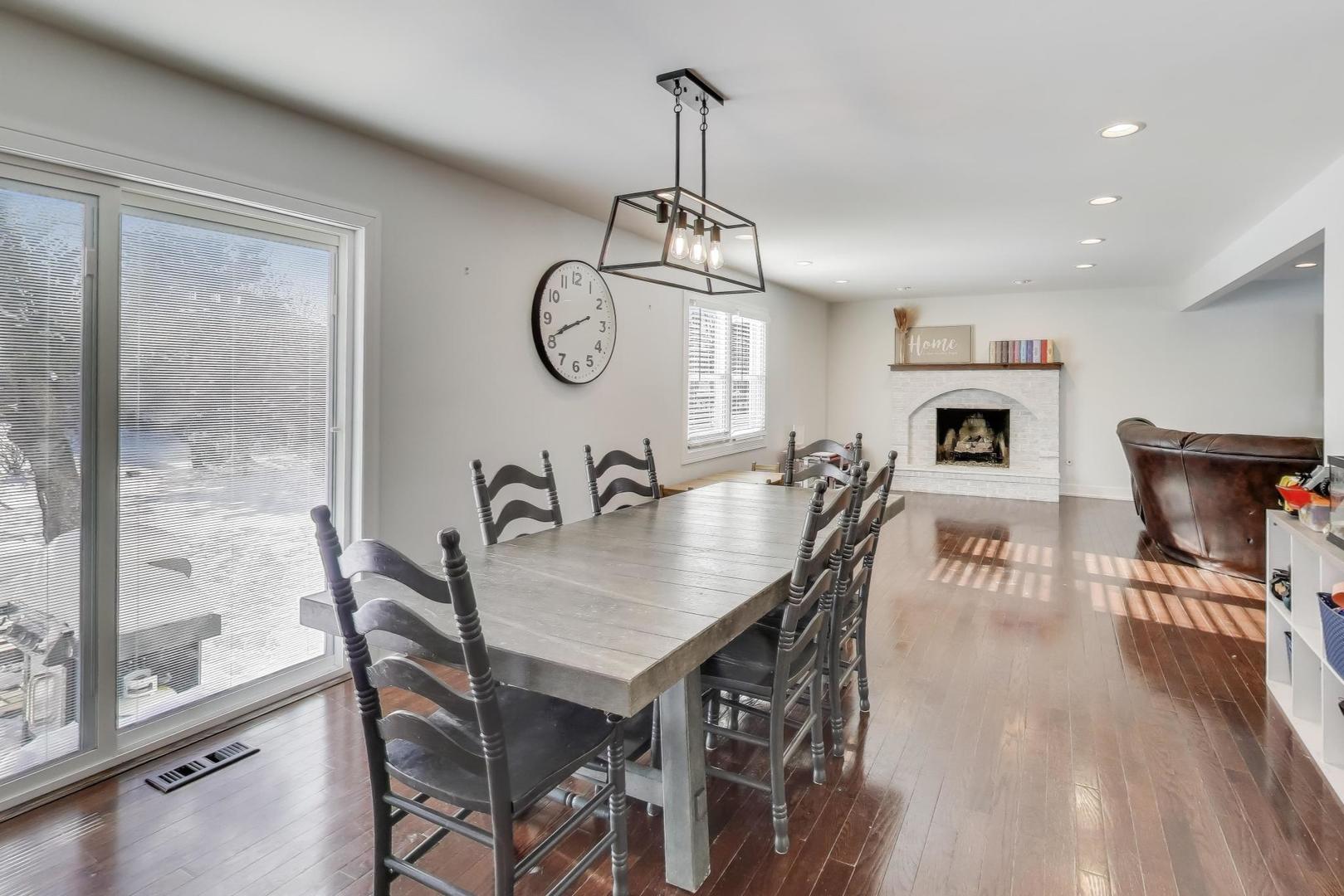 1565 Brittany Lane Hoffman Estates, IL 60192 - Photo 5 of 26 a view of a dining room with furniture window and wooden floor