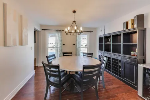 a view of a dining room with furniture and window